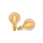 Two vintage-style light bulbs on a white background